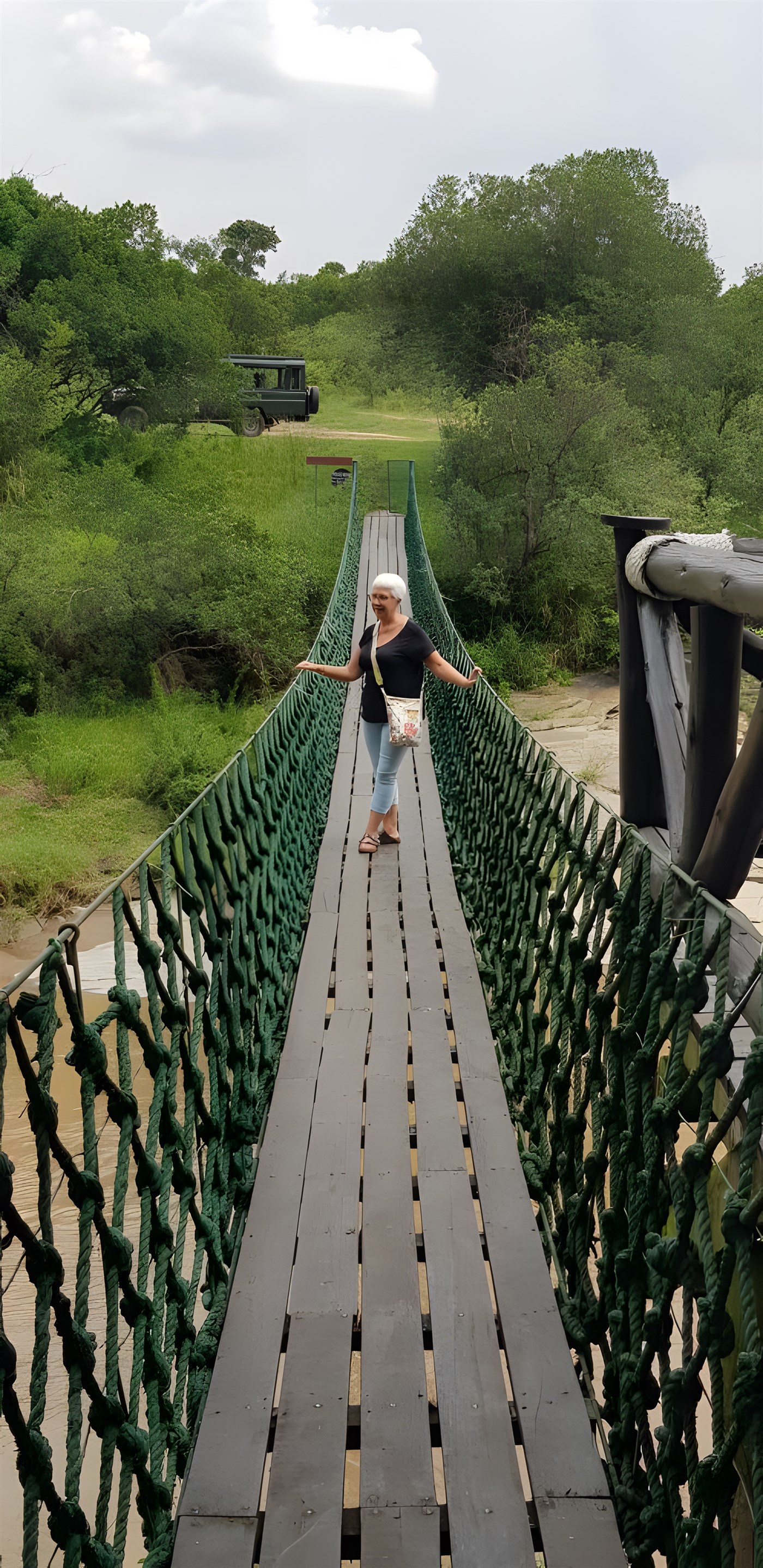 Claire on a bridge across the river