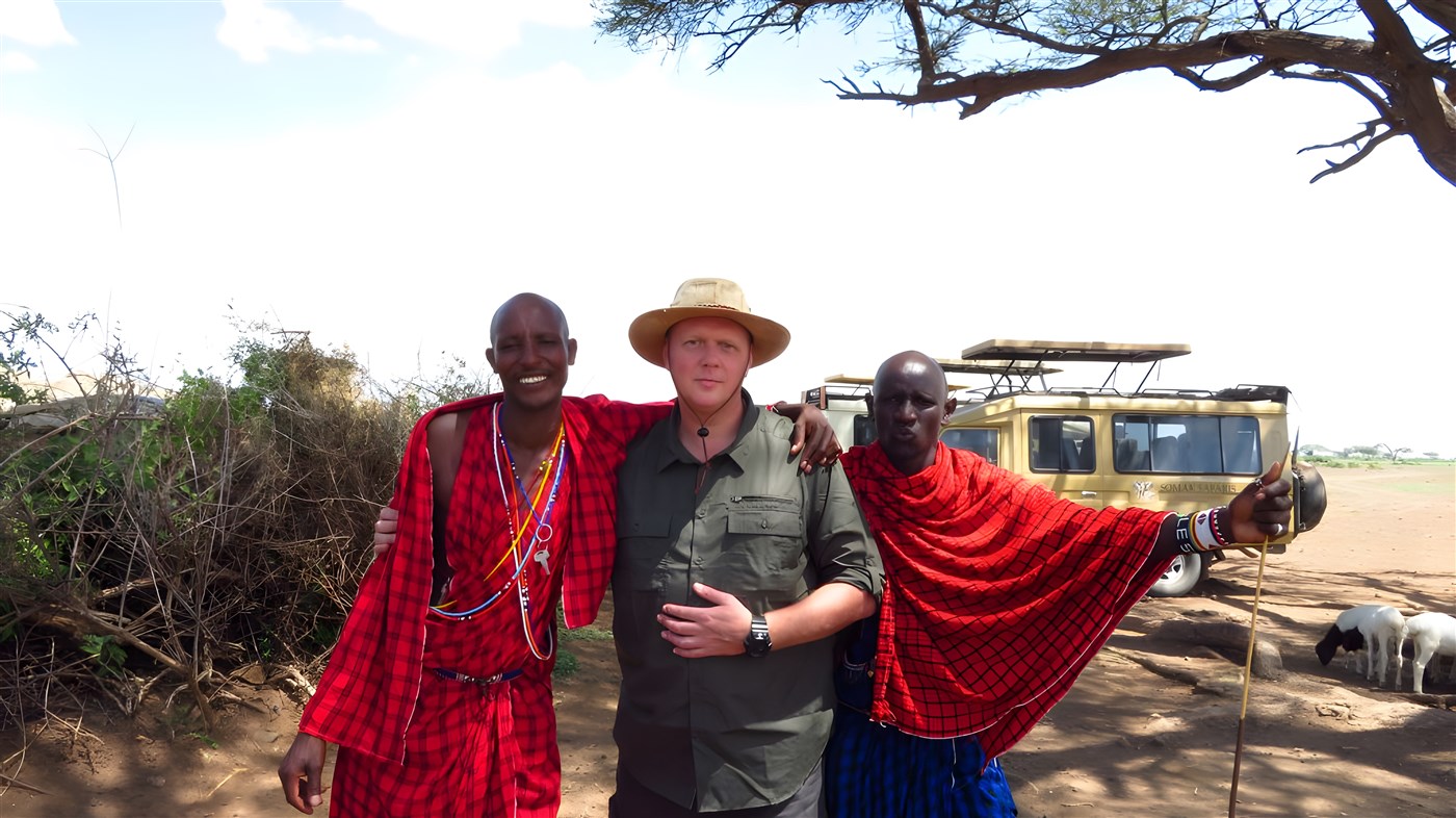 Guest with two Masai warriors