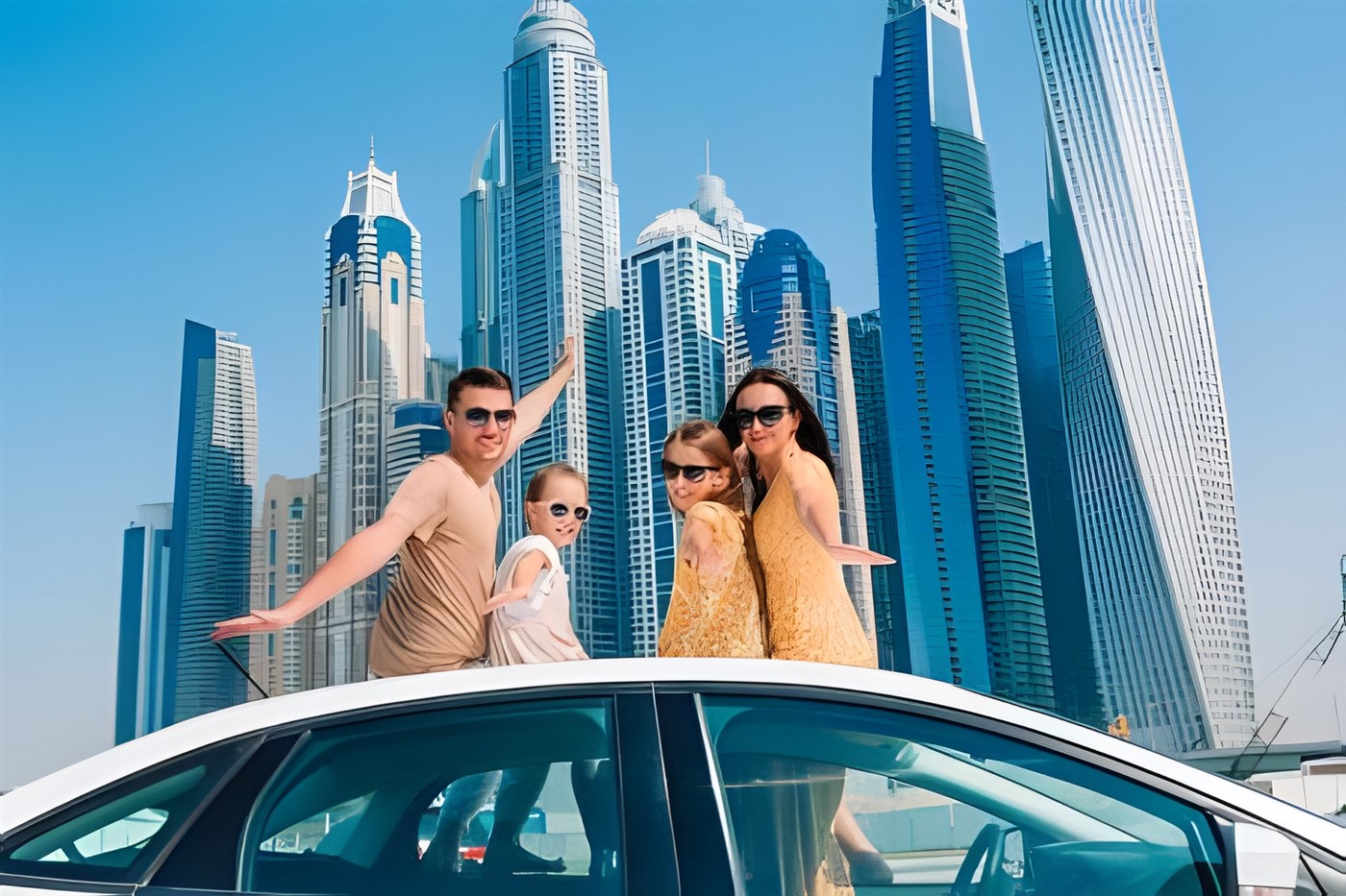 Family posing on a car in front of the Dubai Skyline in a blog about family travel that includes a section about travel to the middle east