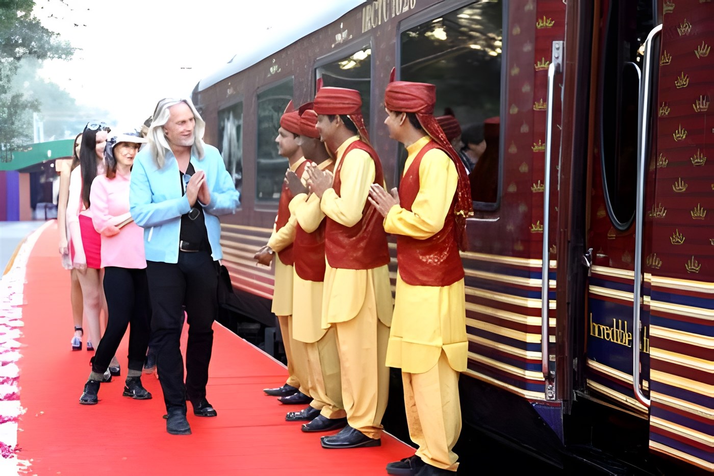 Guests arriving at the Maharaja Express are greeted by staff alongside the train while walking on a red carpet. Source: www.themaharajaexpress.org