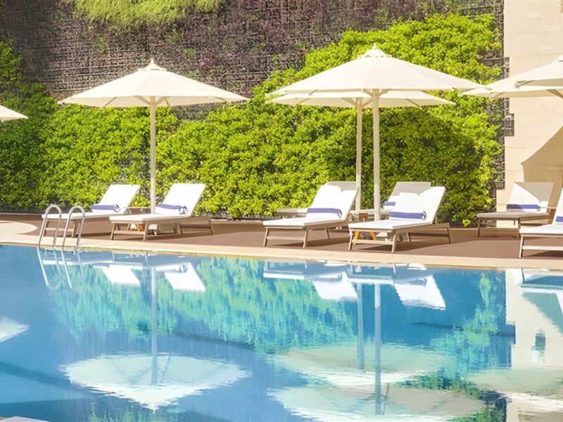 Swimming pol and sun loungers