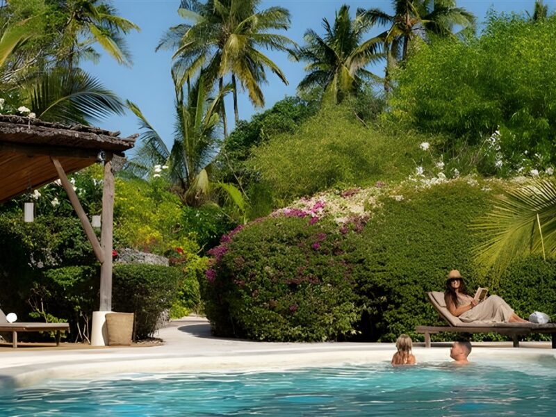 Pool surounded by lush gardens